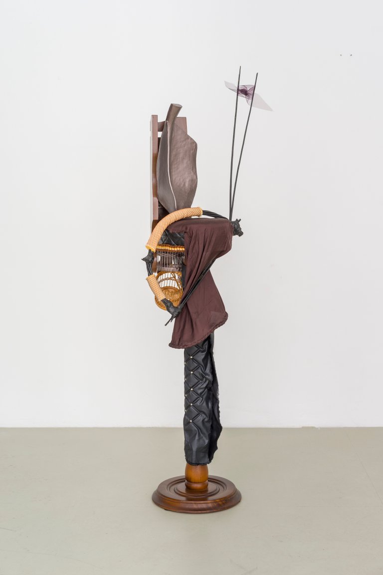 Strip and loom by Miriam Schmitz, 2024, wood, upholstery nails, fabric, foam, raffia, acrylic paint