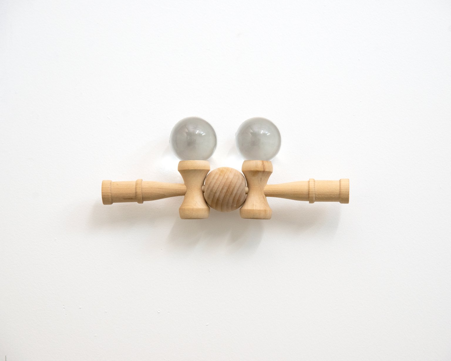Untitled by Matt Muir, 2025, Kendama toys, crystal balls