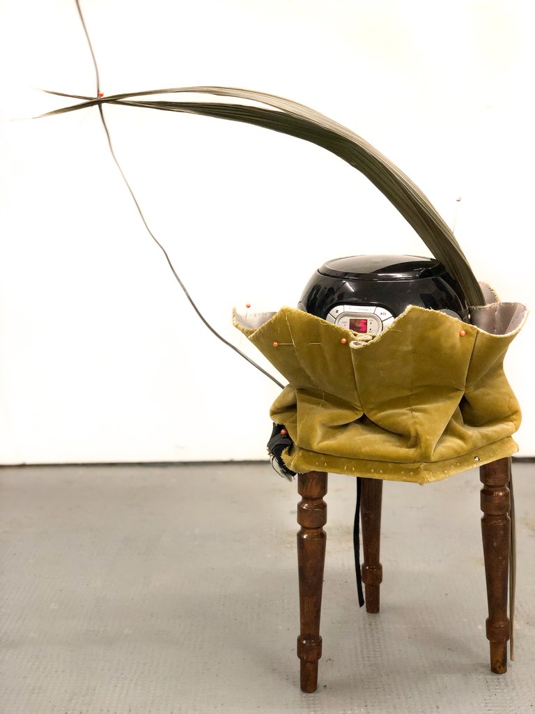 She pulls off every fit by Miriam Schmitz, 2025, wood, fabric, foam, cd-player, pins, acrylic paint, coco palm leaf