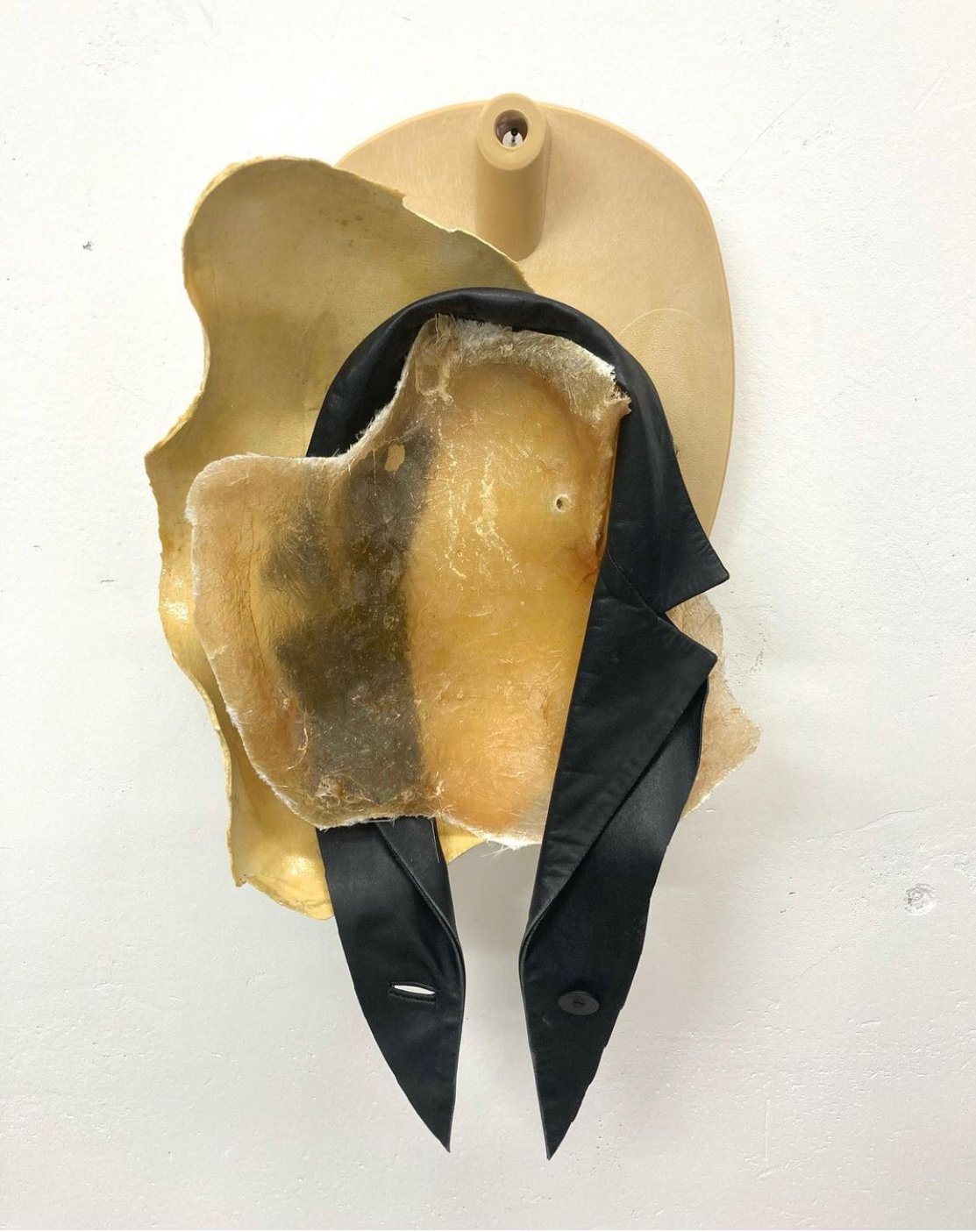 Bleached red by Miriam Schmitz, 2021, gypsum, polyethurane, leather, aluminium