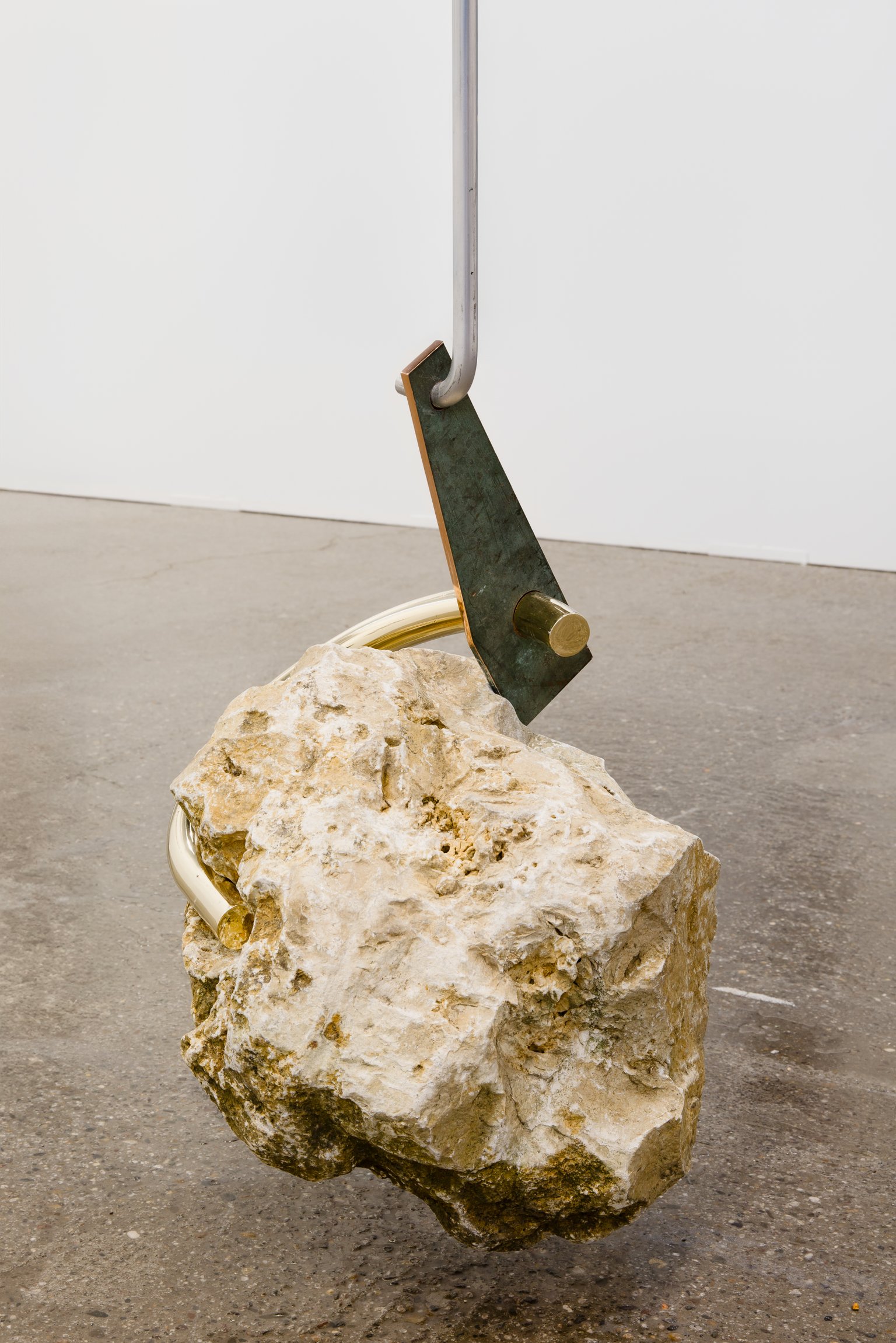 Abschied von der Erde by Nino Maaskola, 2025, stone, brass, copper, aluminum