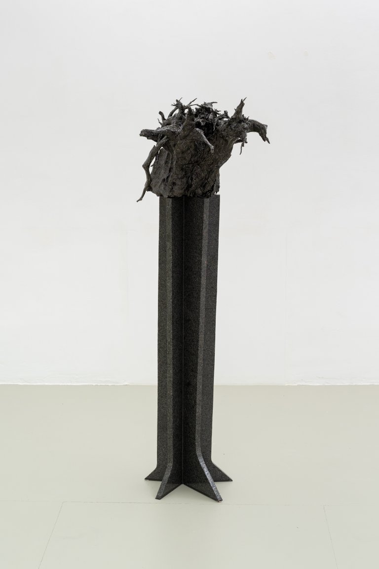 Maa by Nino Maaskola, 2025, granite, wood, resin, pigments