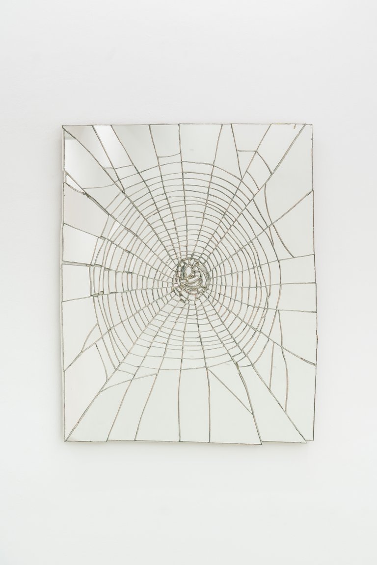 Exit Wound by Eden Dodd, 2023, mirror, silver alloy, wood