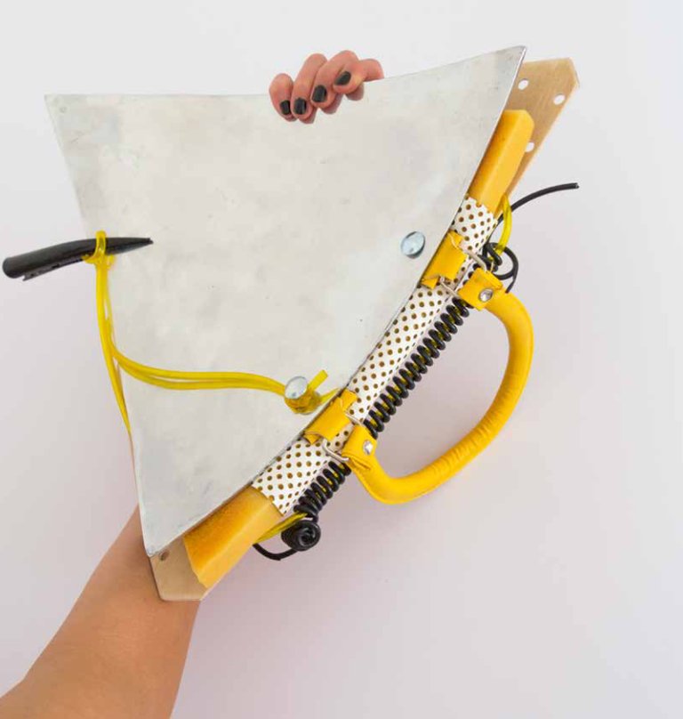 Tap Tap Tapping Tone of sensing through downtown by Miriam Schmitz, 2022, aluminum, wood, foam, leather, cord, hair-clip