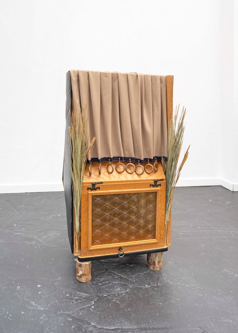 Roots, rock, bells by Miriam Schmitz, 2021, wood, glass, fabric, foam, leather, reed