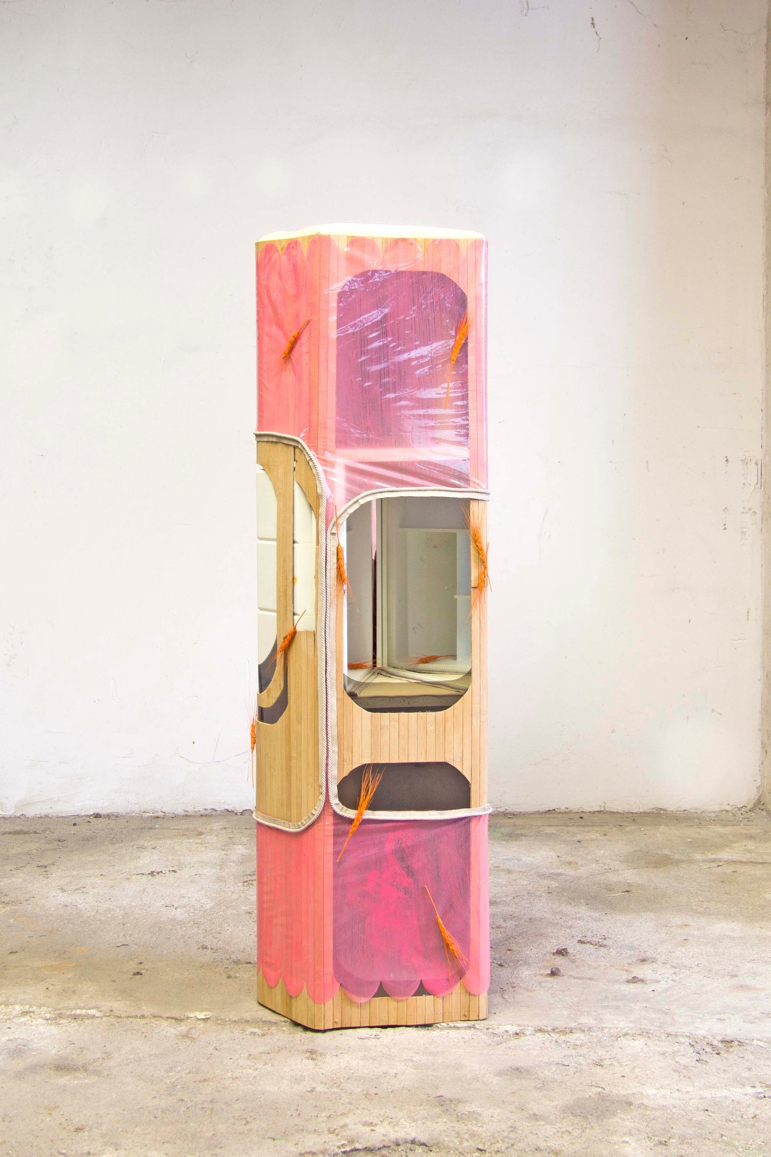Through the doorcrack a peculiar warmth by Miriam Schmitz, 2022, aluminium, bamboo, plastic, acrylic paint, mirror, ear